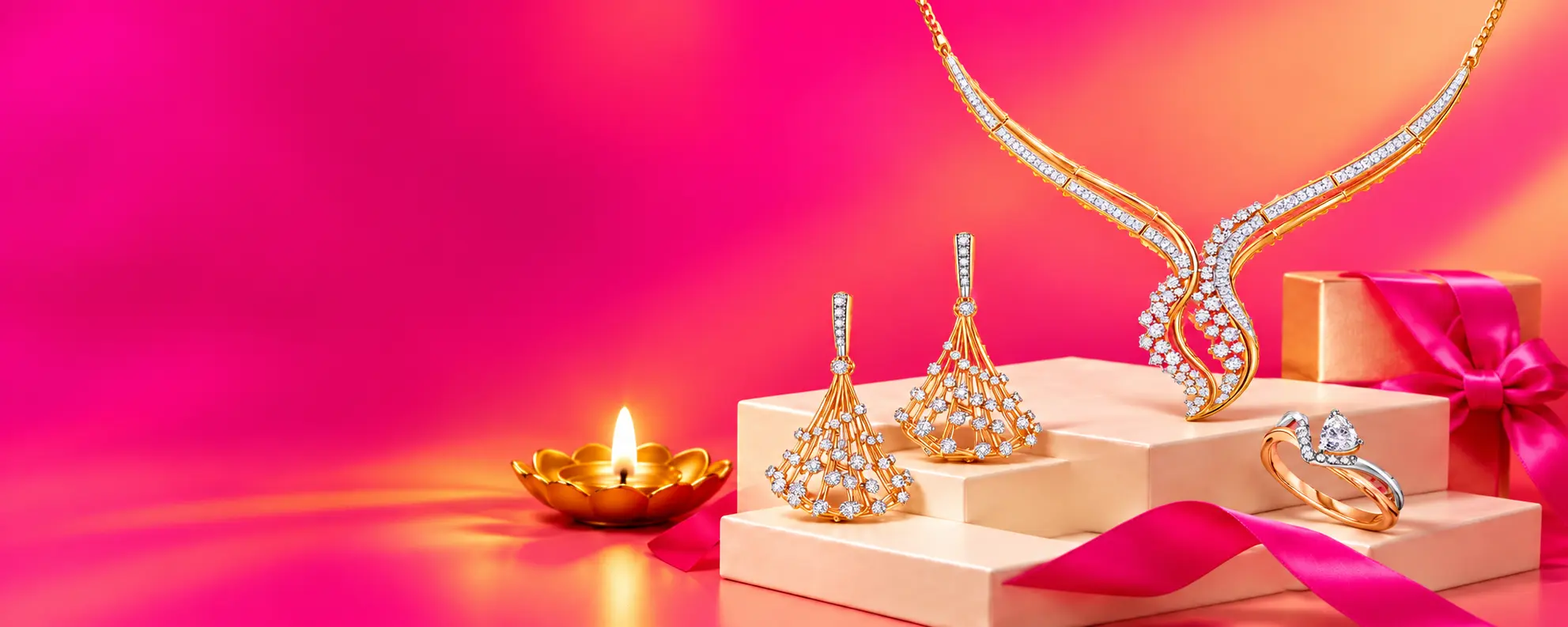 Flame-shaped diamond necklace, cascading gold diamond earrings and a two-tone pear diamond ring on cream gift boxes with pink ribbon and a glowing brass diya